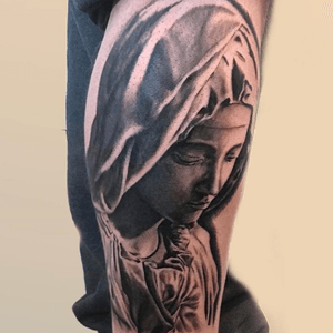Veiled mary tattoo on the calf