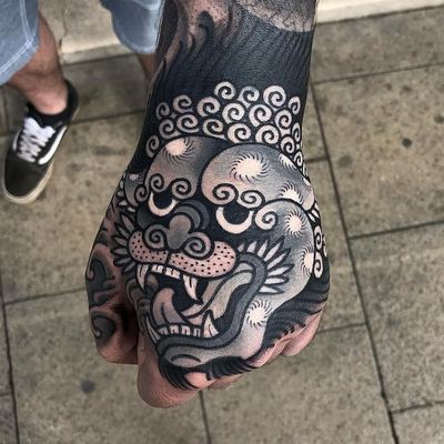Tattoo by James Armstrong #JamesArmstrong #ChineseTattoos #ChineseNewYear #LunarNewYear #Chinese #chineseart #China #blackandgrey #shishi #foodog #handtattoo