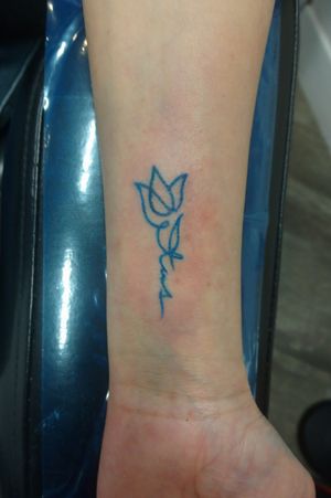 Dainty tattoo on wrist...#scripttattoos #color #design #illustrative #lettering #flowers #dainty #microtattoo #art #byjncustoms