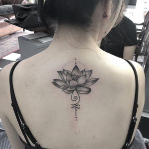 lotus dotwork and linework tattoo