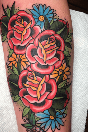 Traditional roses and flowers on forearm 