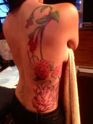 Flower arrangement tattoo on back... 