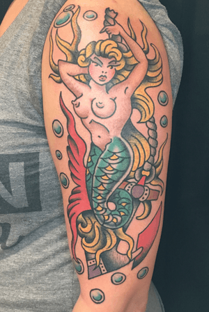 Mermaid tattoo by Carl Hallowell for Ms Kristen, hanging on an anchor underneath the sea... #traditionalamerican #mermaid #anchor #pinup #traditional #CarlHallowell 