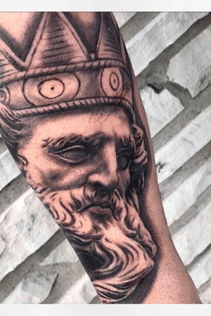 Poesidon tattoo on the forearm