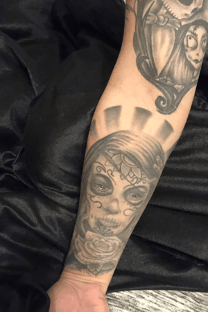 Sugar lady or day of the dead on forearm 