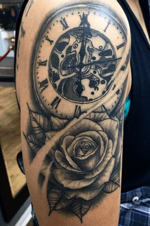 Some black and grey rose/clock duo