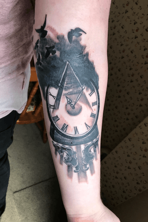 3rd tattoo,  clock infused in a pyramid 