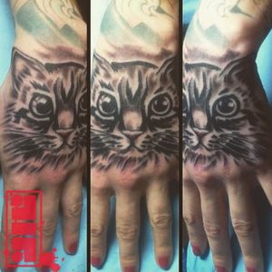 Cat face tattoo on hand...Thanks for looking
