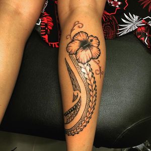 Ladies tribal hibiscus tattoo back of legs