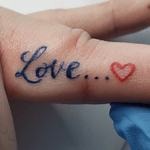 Happy #ValentinesDay you crazy #lovebirds!! We used a dark blue to soften this small #fingertattoo #script and its the absolute perfect #valentinestattoos
