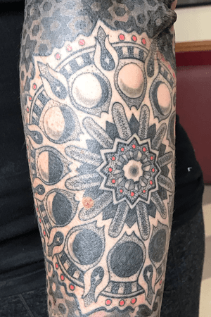 #blackandgrey with limited color #mandala with #moonphases on #forearm with #geometric background