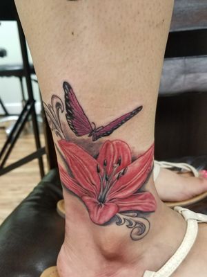 Lilly flower and butterfly tattoo 