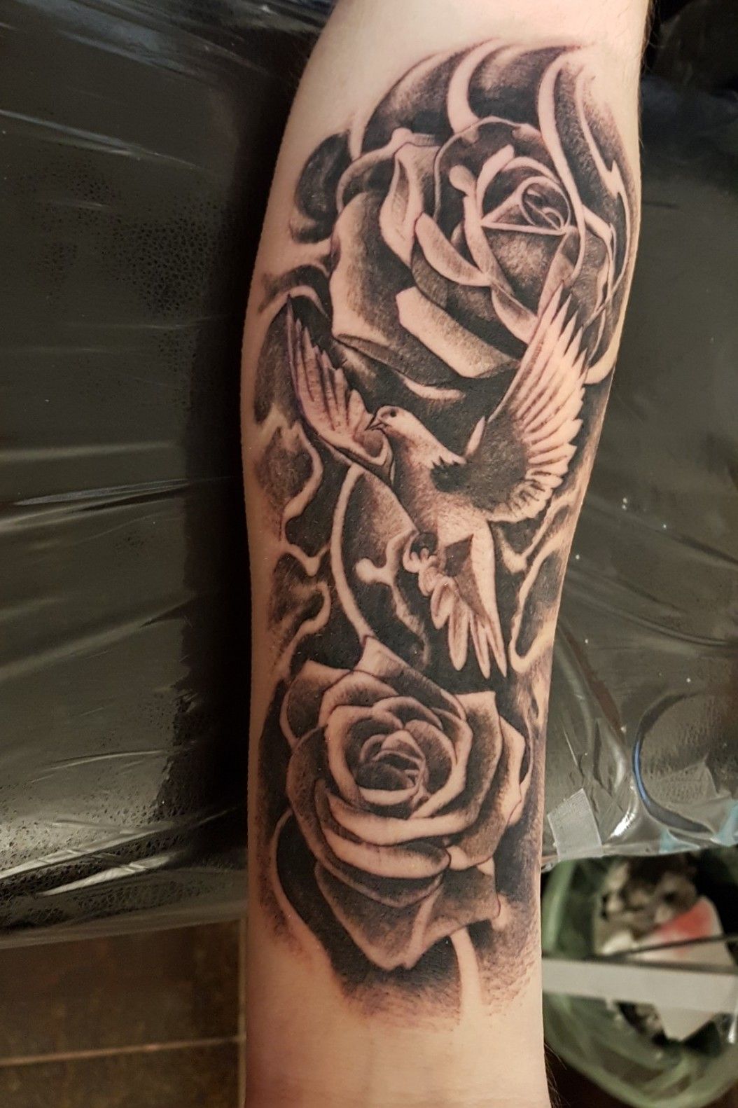 Tattoo uploaded by Leo Abdul • Dove and roses tattoo. #dovetattoo  #rosestattoo #blackandgreytattoo • Tattoodo