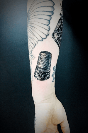 A kittle thimble cool and unusual tattoo