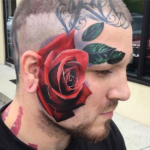 Tattoo by TJ Schunemann #TJSchunemann #facial tattoos #facial tattoo #head tattoo #head tattoo #jobstoppers #rose #flower #flowers #color #realism #leaves #naturaleza