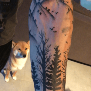 Nature sleeve in progress with my dog in the background behaving very nicely #nature #sleeve #blackandgray #blackwork #trees #birds #lake #clouds #mountains
