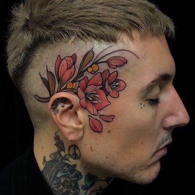 Tattoo by Übler Friedrich #UblerFriedrich #facetattoos #facetattoo #scalptattoo #headtattoo #jobstoppers #flowers #floral #color #neotraditional