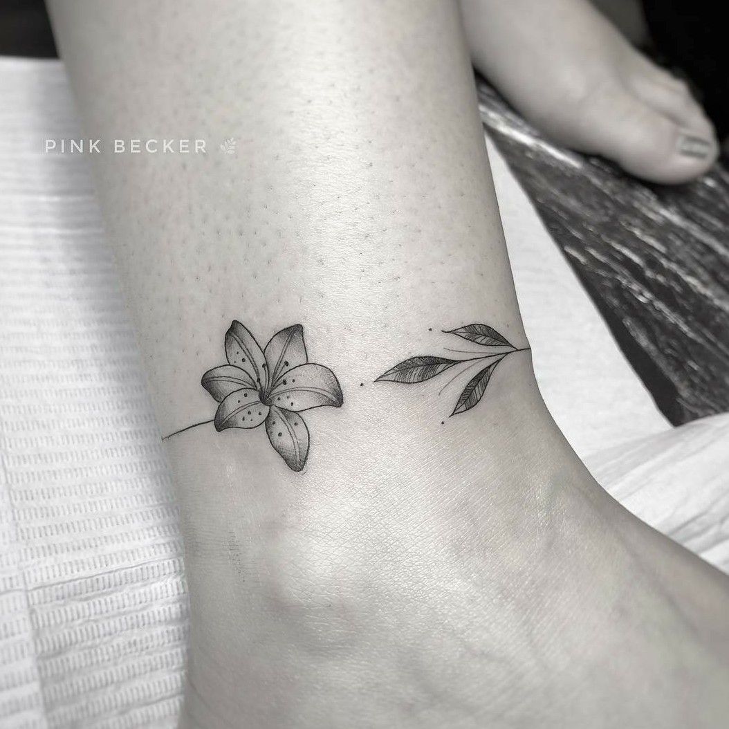 Flower anklet tattoo