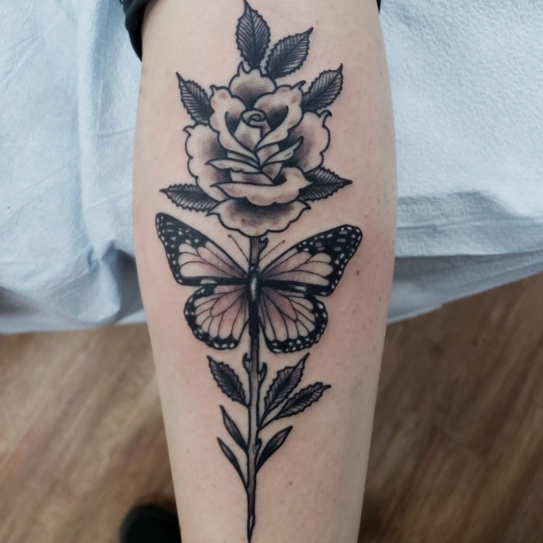 Microrealistic half butterfly half roses tattoo on the
