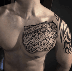 Half chest lettering tattoo