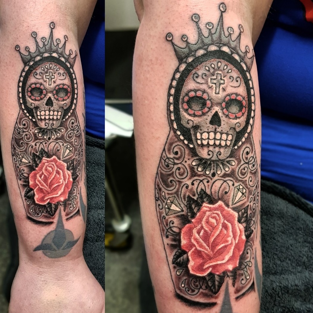 Illustrative sugar skull tattoo on the right inner