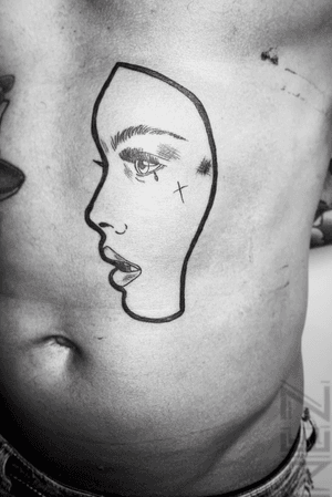 A face I tattooed on a stomach. The irony...