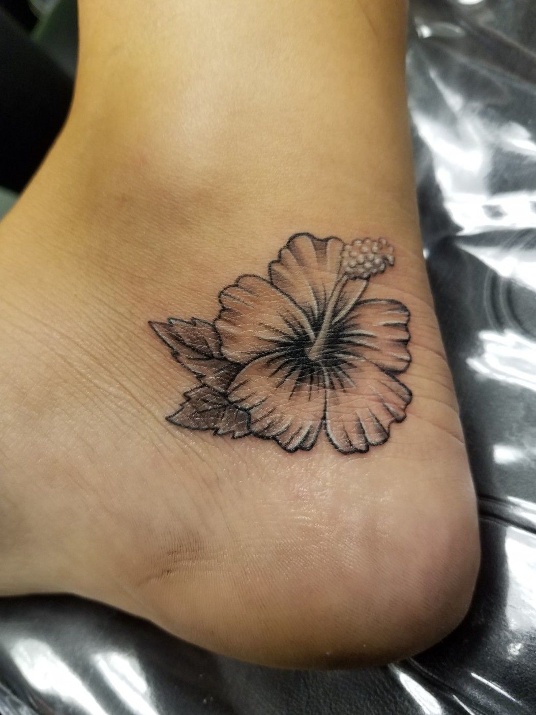 Black and Grey Hibiscus and Plumeria floral tattoo by Camila  Maui Tattoo  Artist at MidPacific Tattoo  MidPacific Tattoo
