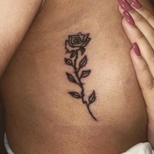 Dainty flower tattoo on cusp on ribs...Thanks for looking. #dainty #microtattoo #cutetattoo #creation #rose #tattooed #tattooartist #illustrative #graphic #design #traditional #finelines #byjncustoms 