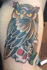 Owl with skull on inside of the upper arm 
