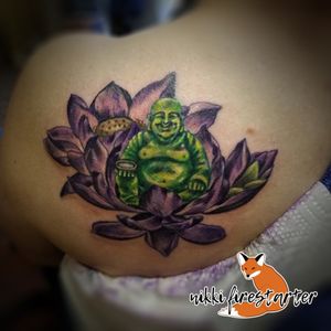 Here's a precious jade Buddha on some lotus flowers that I did back in September. LOOK AT THAT FACE. 👀nikkifirestarter.com#tattoo #bodyart #bodymod #ink #art #nonbinaryartist #nonbinarytattooist #mnartist #mntattoo #visualart #tattooart #tattoodesign #buddha #buddhatattoo #lotus #lotusflower #lotustattoo #flowertattoo #zentattoo #meditation #jadebuddha #purplelotus #ricemilk #floraltattoo
