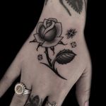 Tattoo by Austin Maples #AustinMaples #Awesometattoos #besttattoos #tattoodoapp #appartists #trendingtattoos #toptattoos #tattoodoappartists #rose #flower #blackandgrey #handtattoo #sparkle #stars