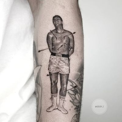 Tattoo by Goldy Z #GoldyZ #blackandgreyrealism #blackandgrey #realism #realistic #hyperrealism #MuhammadAli #stsebastian #portrait #arrows #blood #boxer #everlast