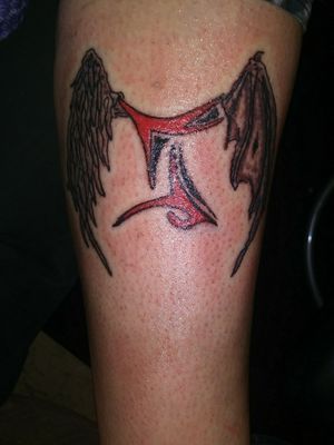 Cover up/fixing a bad design using gemini symbol with wings.
