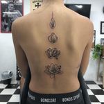 Lotus flower in full bloom back piece. Dotwork and linework tattoo