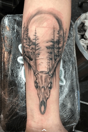 Deer skull with moon and trees 