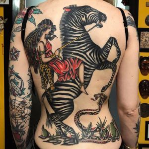 Tattoo by Joe Tartarotti #JoeTartarotti #traditionaltattoo #traditional #color #Italy #italiantattooartist #lady #zebra #cobra #snake #cacti #backpiece