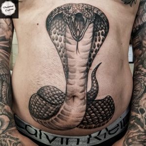 Cobra on the stomach tattoo
