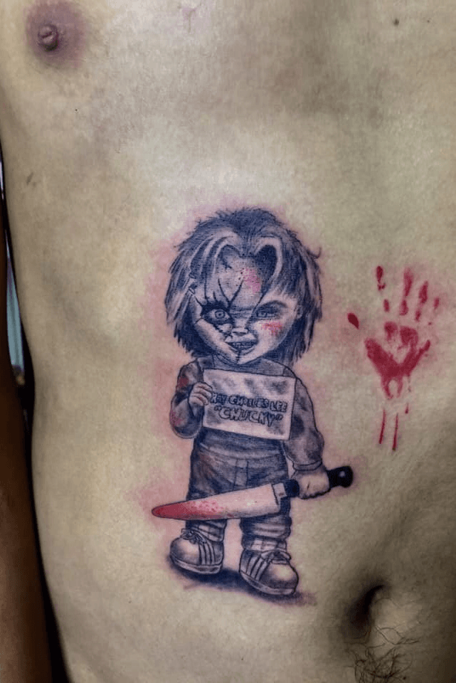 Outline Chucky With Knifes Tattoo Design