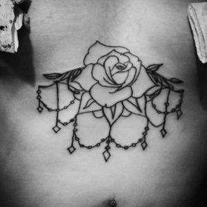 Rose sternum tattoo