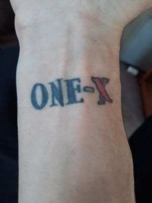 Tattoo number two.This was a piece I've wanted since i was in high school. It has such a deep meaning. It represents everything i over came through my teenage years. It's for the song "One X", as well as the album under the same name, by the band Three Days Grace. Done at Rising Phoenix in IL.#bandtattoo #meaningful #one-x #wristtattoo 