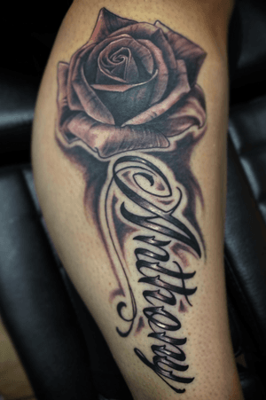 Rose tattoo with husbands name “Anthony” 
