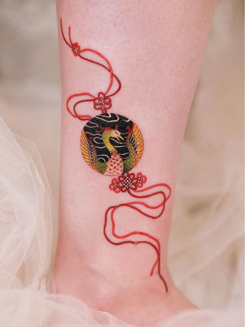 Tattoo by Sion #Sion #cutetattoos #cutetattoo #cute #color #realism #realistic #phoenix #knot #decorative #ornamental #jewelry #feathers #bird #animal #nature