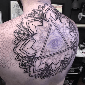 BIG progress on this back piece yesterday for my man @tattoosbylee_whitedragon This was the first full day sitting and one more should see it completed, thanks for looking!! 🙏🏼 #blackwork #mandala #mandalatattoo #linework #geometric #eyetattoo #backtattoo