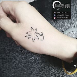 Mini lotus tattoo