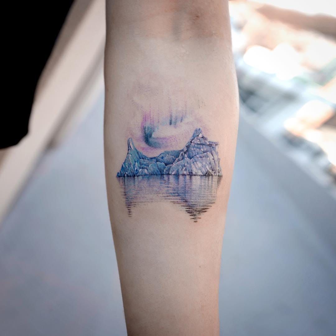 Aurora borealis in a triangle tattoo  Tattoogridnet