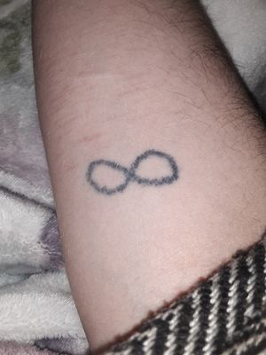 Infinity - homemade stick n pokeFirst tattoo - done 6 years ago on right forearm. This tattoo was also done by a friend with no experience. But those tattoos are my favorite kind. 