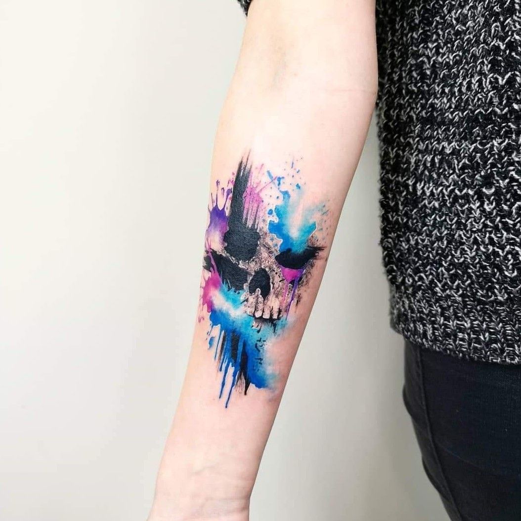 Abstract Skull With Anchor Tattoo On Man Left Side Rib
