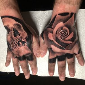 black and grey rose and skull hand 