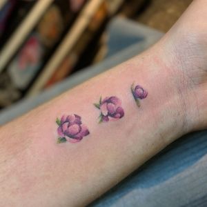 Tiny Flower Stages Tattoo