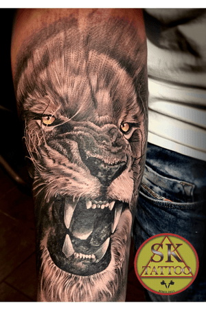 Lion tattoo hand